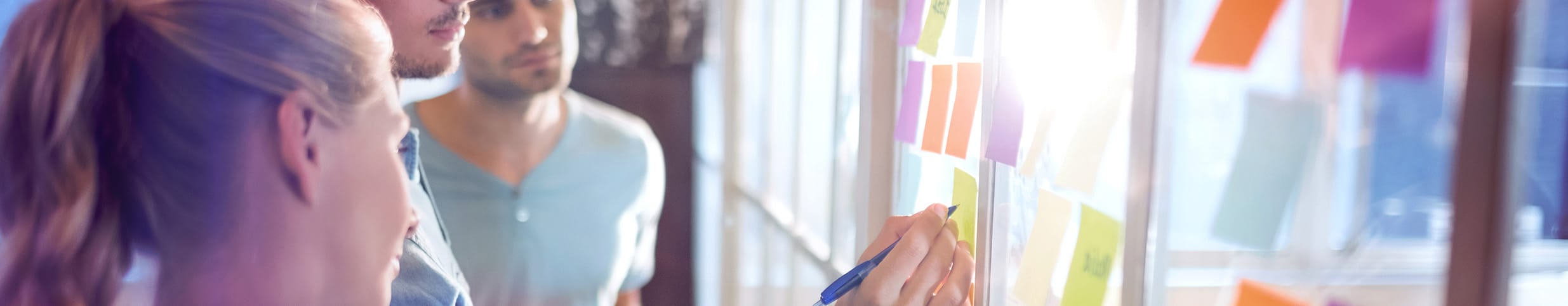 photo of team members using post-its